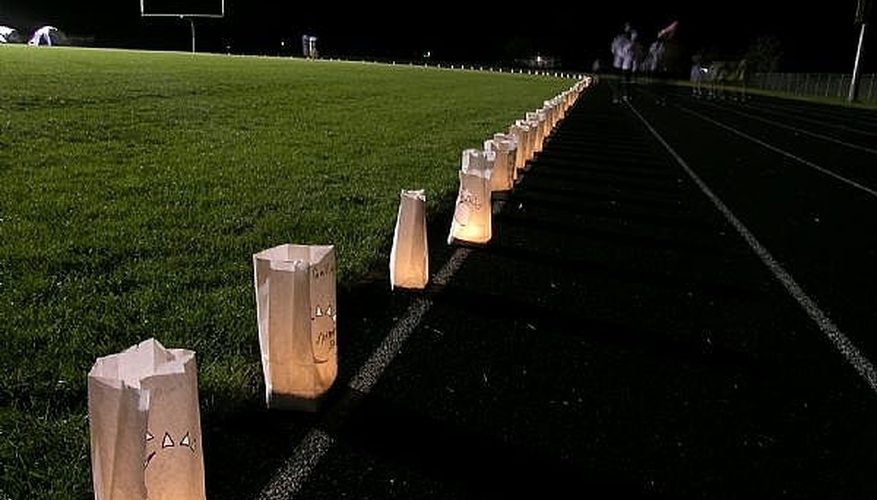 Candles lit for the annual Candle Light Relay track workout